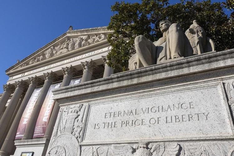 ɫtv Archives working to clean up red powder dumped on Constitution display by protesters