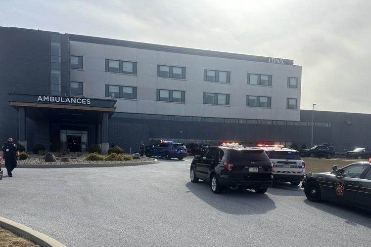 Prosecutor says officer killed in gunman's Pennsylvania hospital siege was hit by police fire