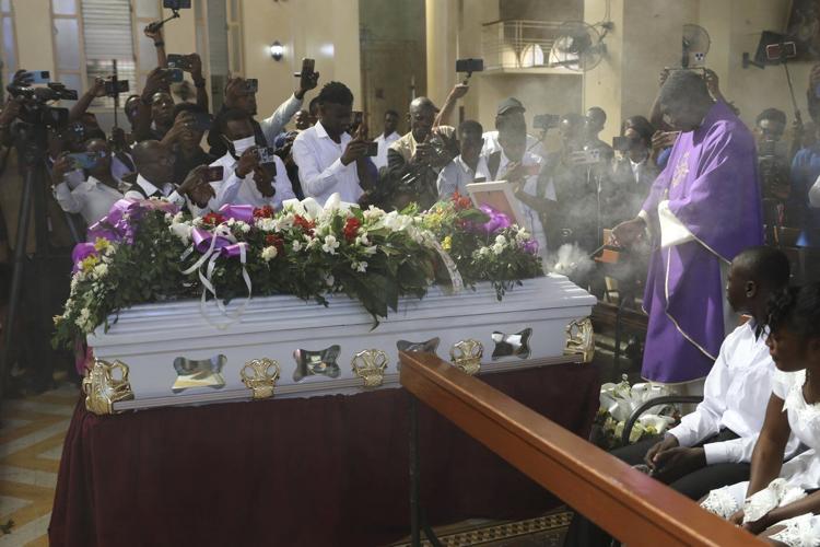 Mourners bury journalist killed in one of Haiti's worst attacks on reporters