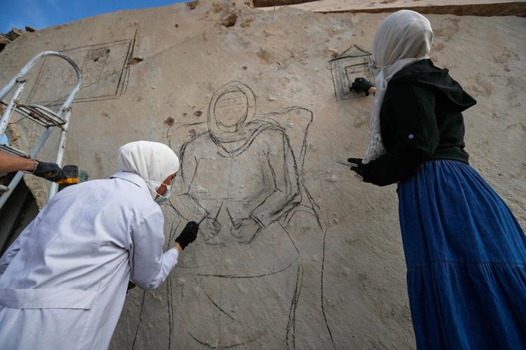 Syrian artists transform bombed-out house into a mural of remembrance, in photos