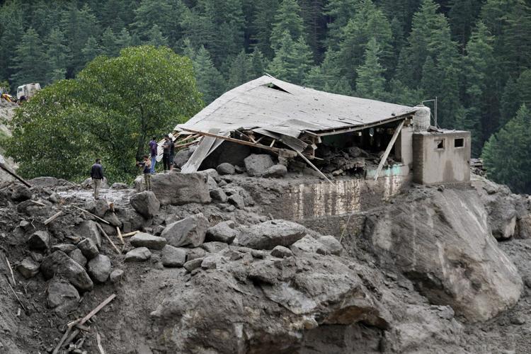 Flash floods triggered by torrential rains kill at least 120 people in India and Pakistan