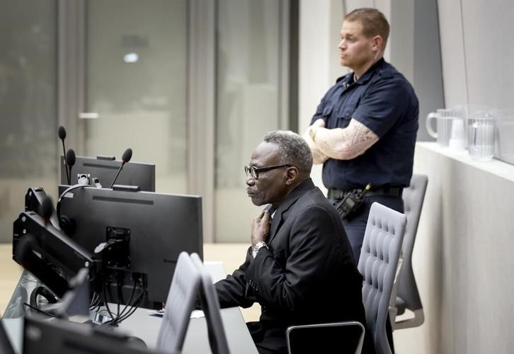 An alleged Darfur militia leader was merely 'a pharmacist,' defense lawyers tell a war crimes court