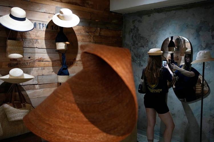 The sunhat is everywhere in Athens as crowds grow larger at ancient sites