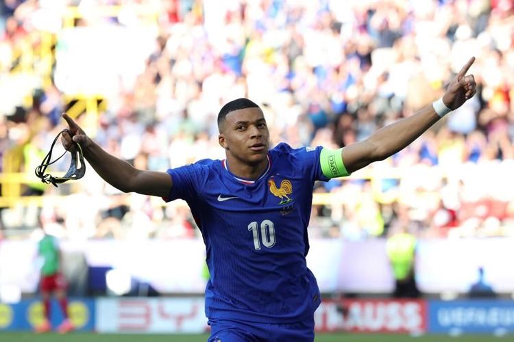Kylian Mbappé scores on return from broken nose and France draws 1-1 with Poland at Euro 2024