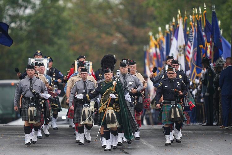 Police gather for the funeral of 3 Pennsylvania detectives ambushed by gunman