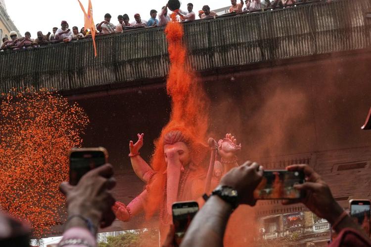 Photos show Indians marking final day of Ganesh Chaturthi that ends with sea immersion
