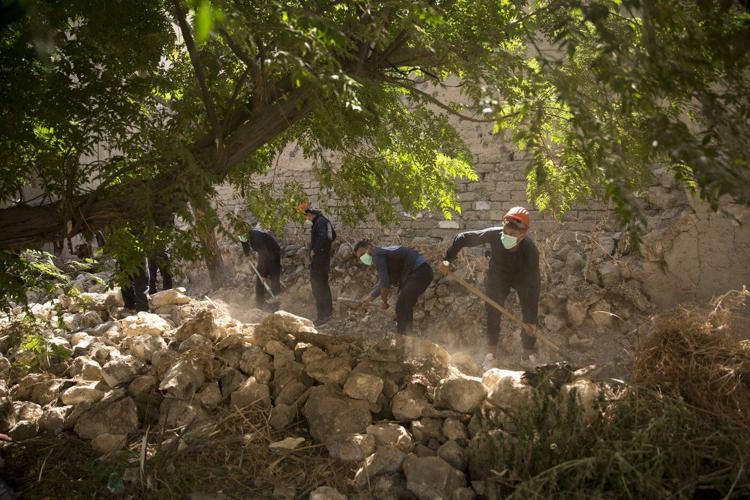 Remains of 30 people believed killed by IS militants found in Syria in a search by Qatar and FBI