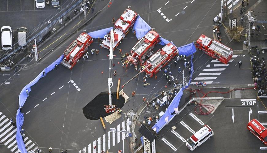 Japan tries to rescue man stuck in sinkhole. Here's what's going on.
