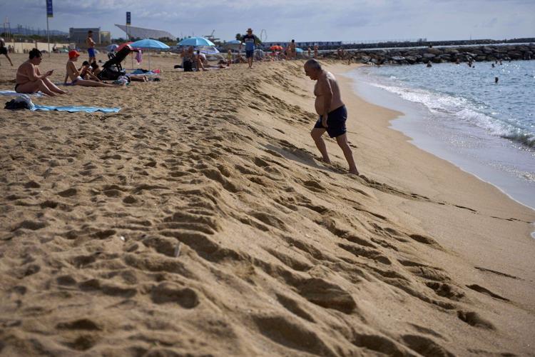 As Spaniards summer at Barcelona's beaches, some worry about the erosion of coastline