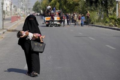 Civilians fleeing northern Gaza's combat zone report a terrifying journey on foot past Israeli tanks