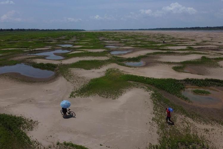 In the Amazon, communities next to the world's most voluminous river are queuing for water