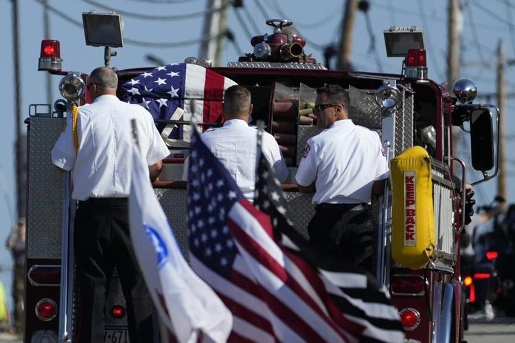 Firefighter killed at Trump rally honored with bagpipes, gun salute and a bugle sounding taps