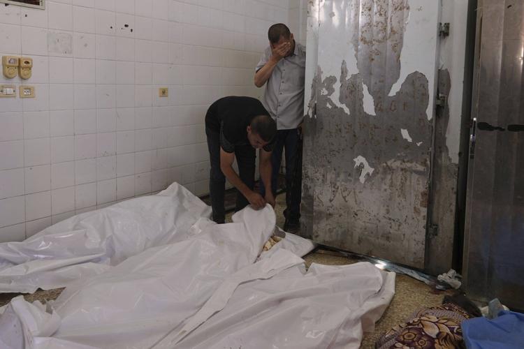 An Israeli strike kills 18 Palestinians in central Gaza as turmoil mounts over food distribution