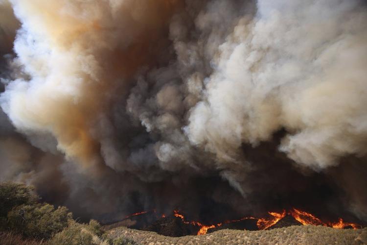 Over 50,000 under evacuation orders or warnings as wildfire imperils homes north of Los Angeles