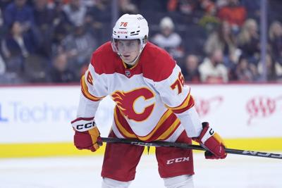 Pospisil's heavy-hitting return a bright spot in Flames' loss to Penguins