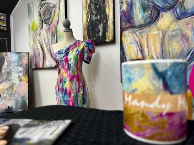 Artist’s hand-painted dress to match her work goes viral