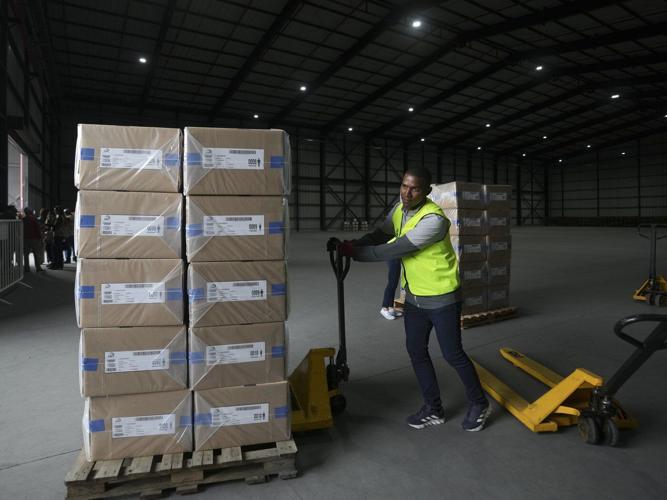 Polls open in Ecuador with conservative incumbent and leftist lawyer leading the presidential race