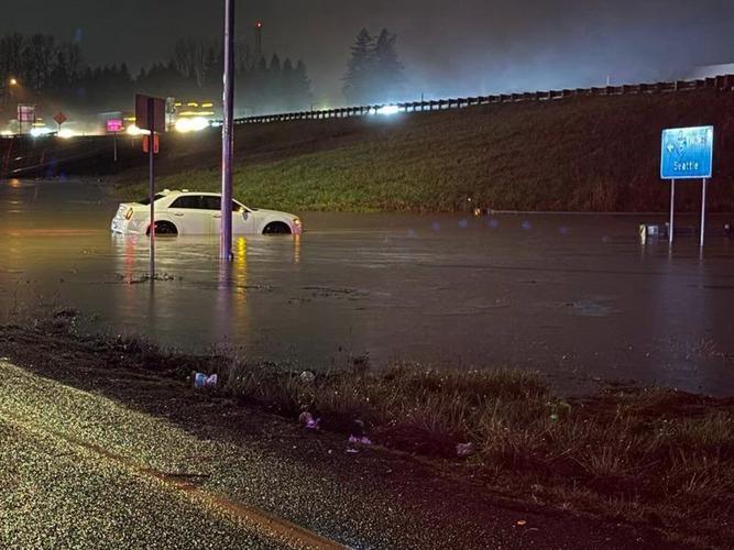 Storms bring heavy rain to the Pacific Northwest, snow and freezing rain to the Upper Midwest