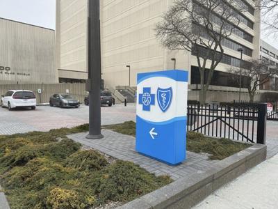 Major Michigan insurer in talks to settle lawsuits over fired workers and COVID-19 vaccine