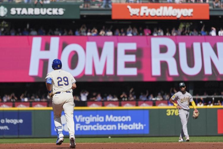 Cal Raleigh hits his 48th, 49th homers to set MLB season mark for catchers, passing Salvador Perez