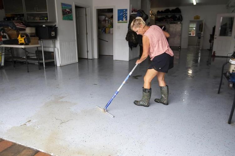 Tropical Storm Debby doles out repeat deluges for weather-weary residents