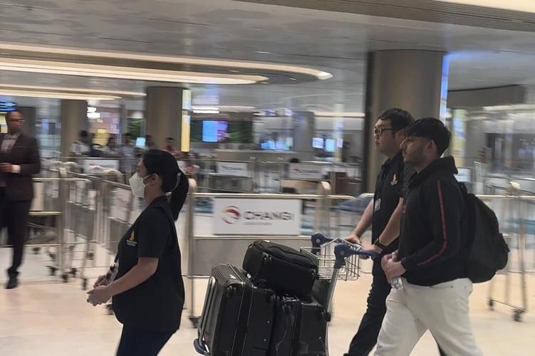 Most of passengers from battered Singapore Airlines jetliner flown arrive in Singapore from Bangkok