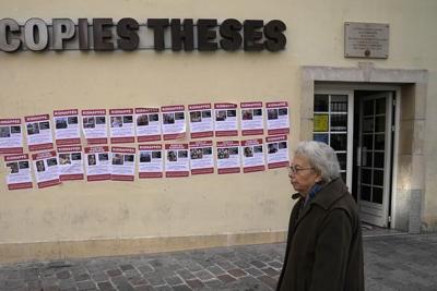 Jewish students plaster Paris walls with photos of French citizens believed held hostage by Hamas