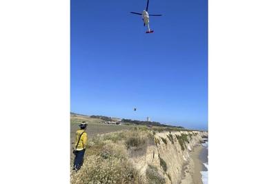 Kite surfer rescued from remote California beach after making 'HELP' sign with rocks