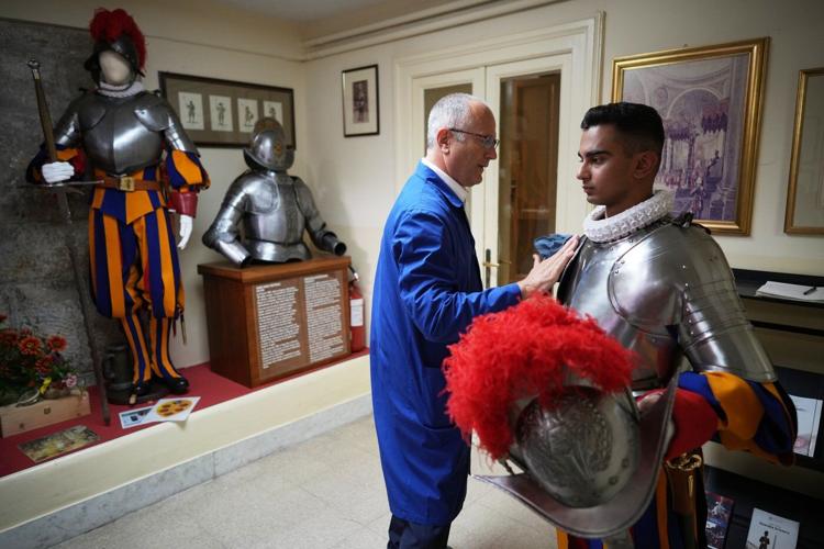 A look at Swiss Guards preparing for a swearing-in ceremony attended by the Pope, in photos