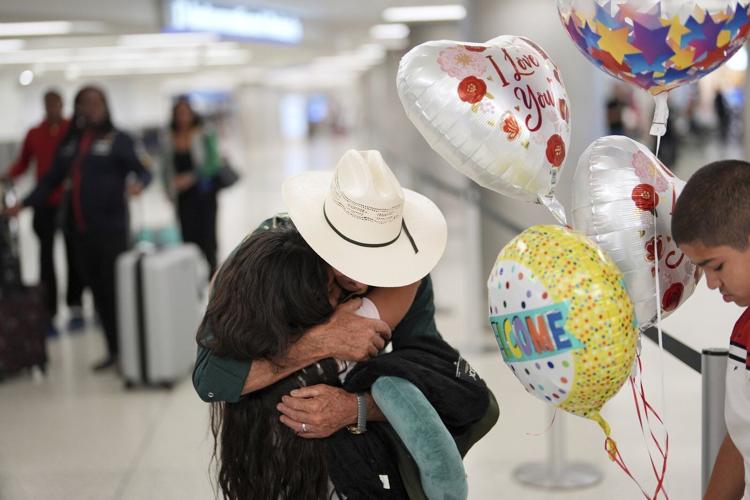 AP PHOTOS: Trump's new travel ban takes effect, and some protest