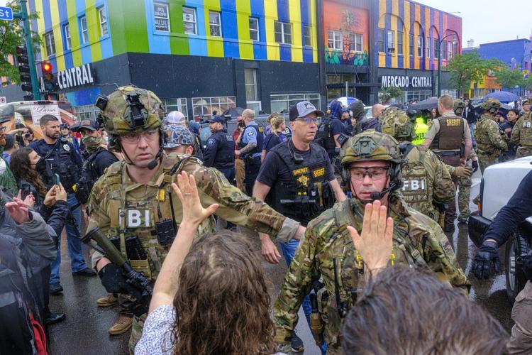 Federal officers in tactical gear went into a Latino community in Minneapolis. A protest followed