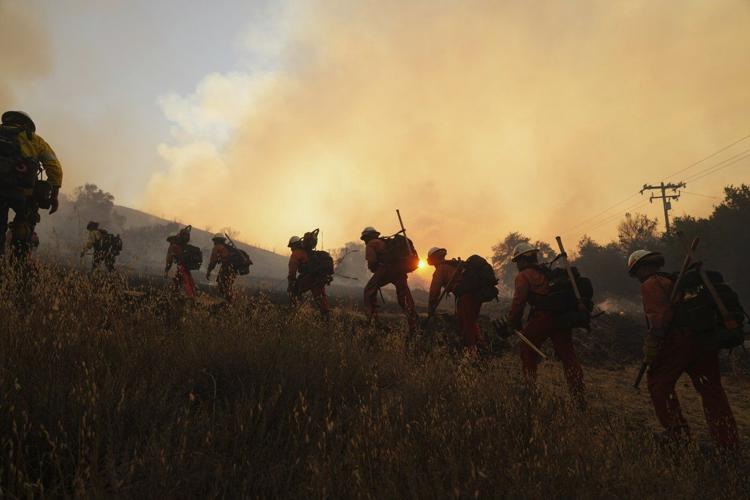 Rapidly spreading brush fire prompts an evacuation order for thousands north of Los Angeles