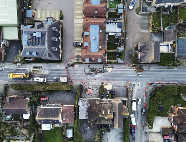 Sinkhole opens up on the main street of an English village