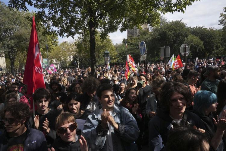 Protesters block roads and start fires across France to challenge the new prime minister, in photos