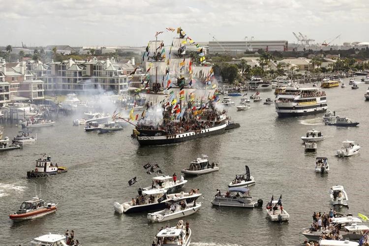 Revelers in festive dress fill downtown Tampa, Florida, for the annual Gasparilla Pirate Fest