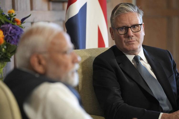 Photos of Britain's Starmer and India's Modi sealing a major trade agreement