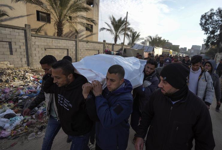 Israeli airstrikes in Gaza kill at least 21, hospital workers say, as talks underway