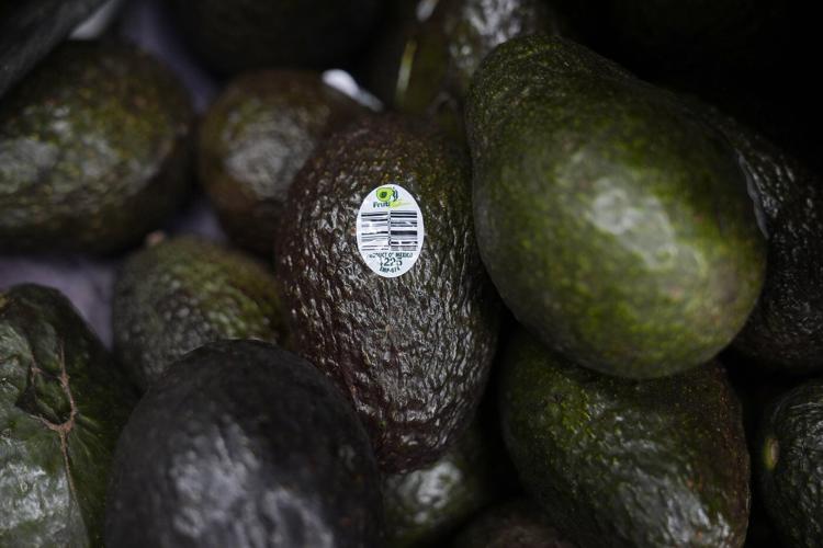 The Latest: Trump's economic disruptions moving markets downward