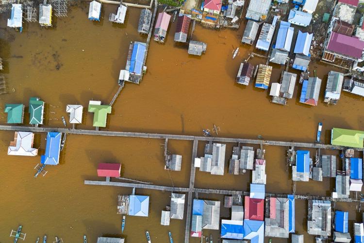Global demand spurring Indonesia's mining boom comes at a cost for many communities
