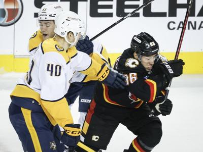 Kuzmenko's costly penalties overshadow return to Flames' lineup