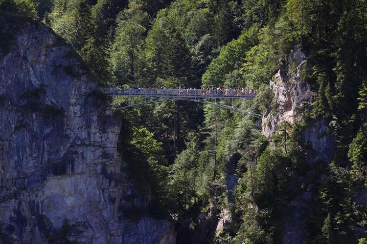 American woman who survived being thrown into ravine near German castle is released from hospital