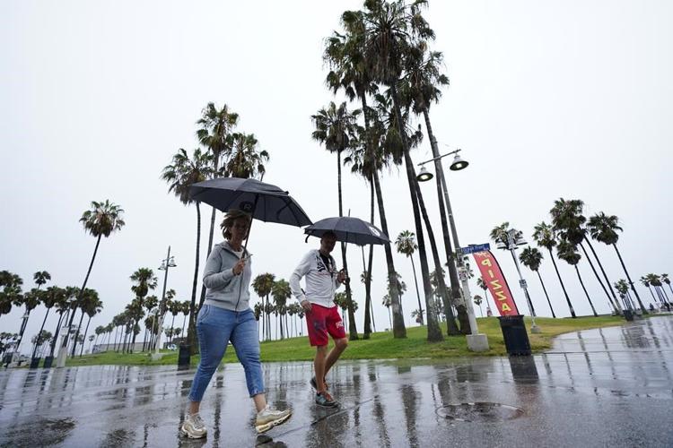 Rain from Tropical Storm Hilary lashes California and Mexico, swamping roads and trapping cars