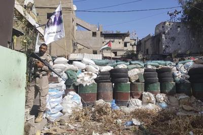 Palestinian security force deploys in school compound in Lebanon refugee camp following clashes