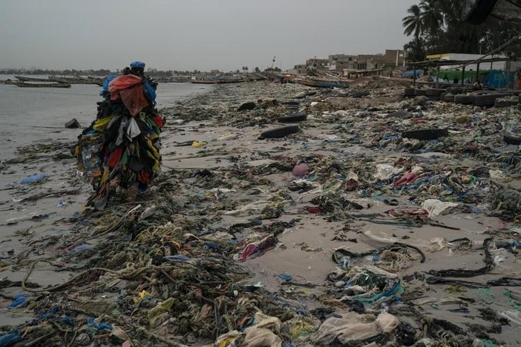AP PHOTOS: 'Plastic Man' in Senegal on mission against trash