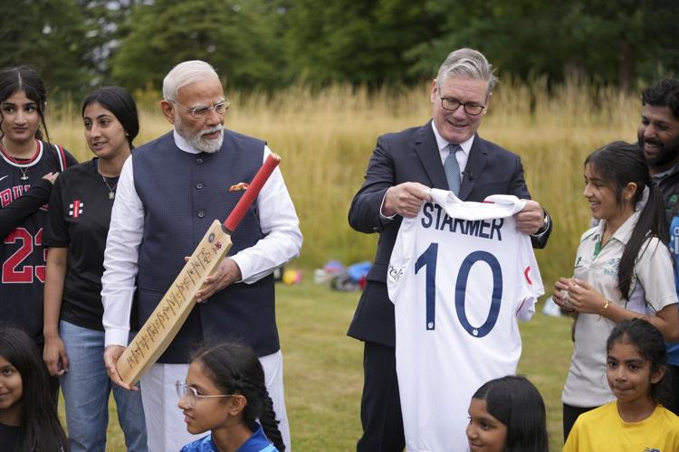 Photos of Britain's Starmer and India's Modi sealing a major trade agreement