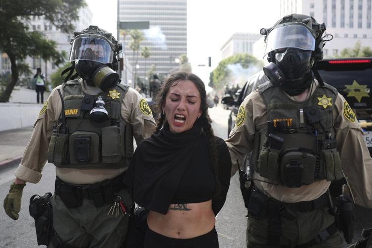 What to know about debate over protesters and ICE agents wearing masks amid immigration crackdowns