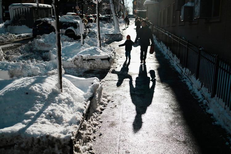 Northeast US scrambles to clear piles of snow as new storm descends on the region