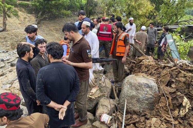 Flash floods triggered by heavy rains kill at least 49 people in northwestern Pakistan