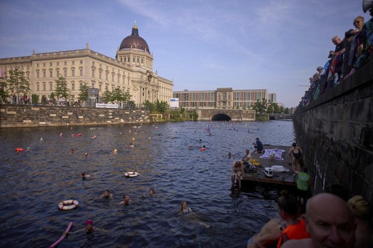Berliners jump into the Spree River to show it's clean enough for swimming