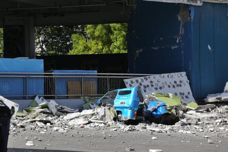 A 7.8 magnitude quake in the Philippines kills at least 32, collapses buildings and sparks tsunami